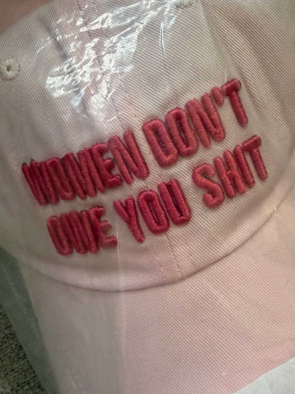 Pink “women don’t owe you shit” hat